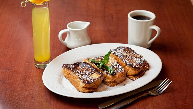 French toast breakfast with side of orange juice and coffee