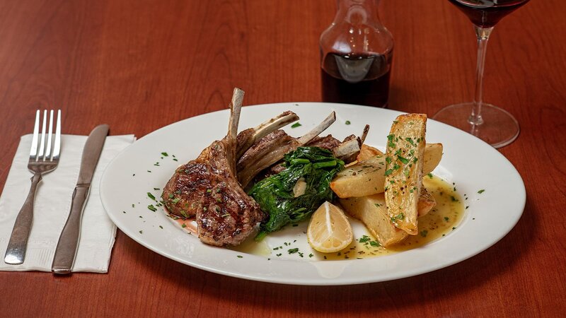 Lamb with sauteed spinach and fries