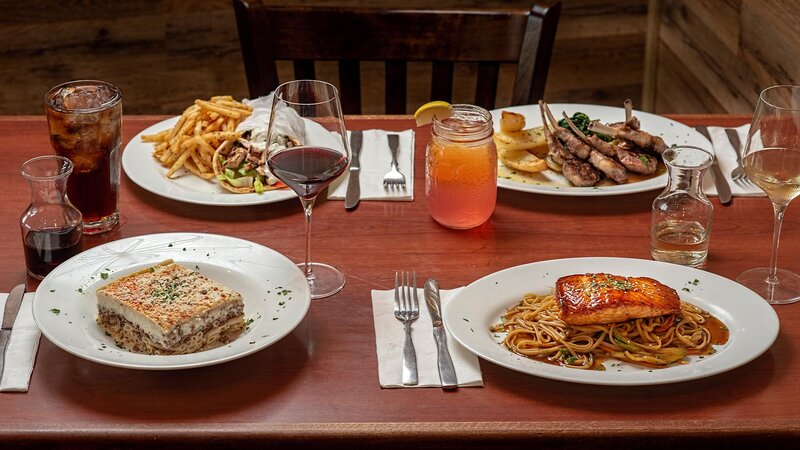 Multiple entrees featuring salmon, gyro platter, lamb and pastitsio entrees